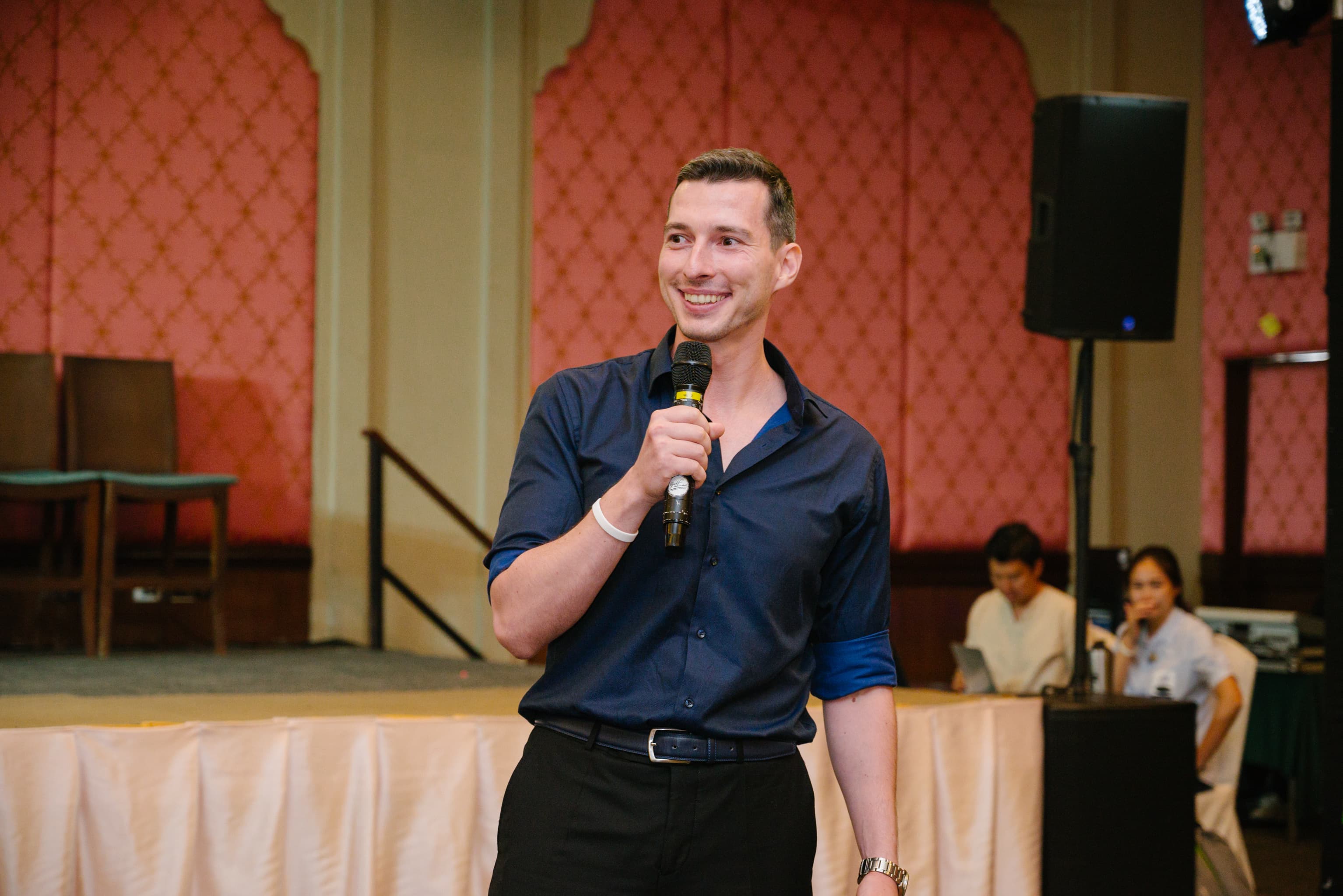 Simeon Krastev speaking on stage in Manila